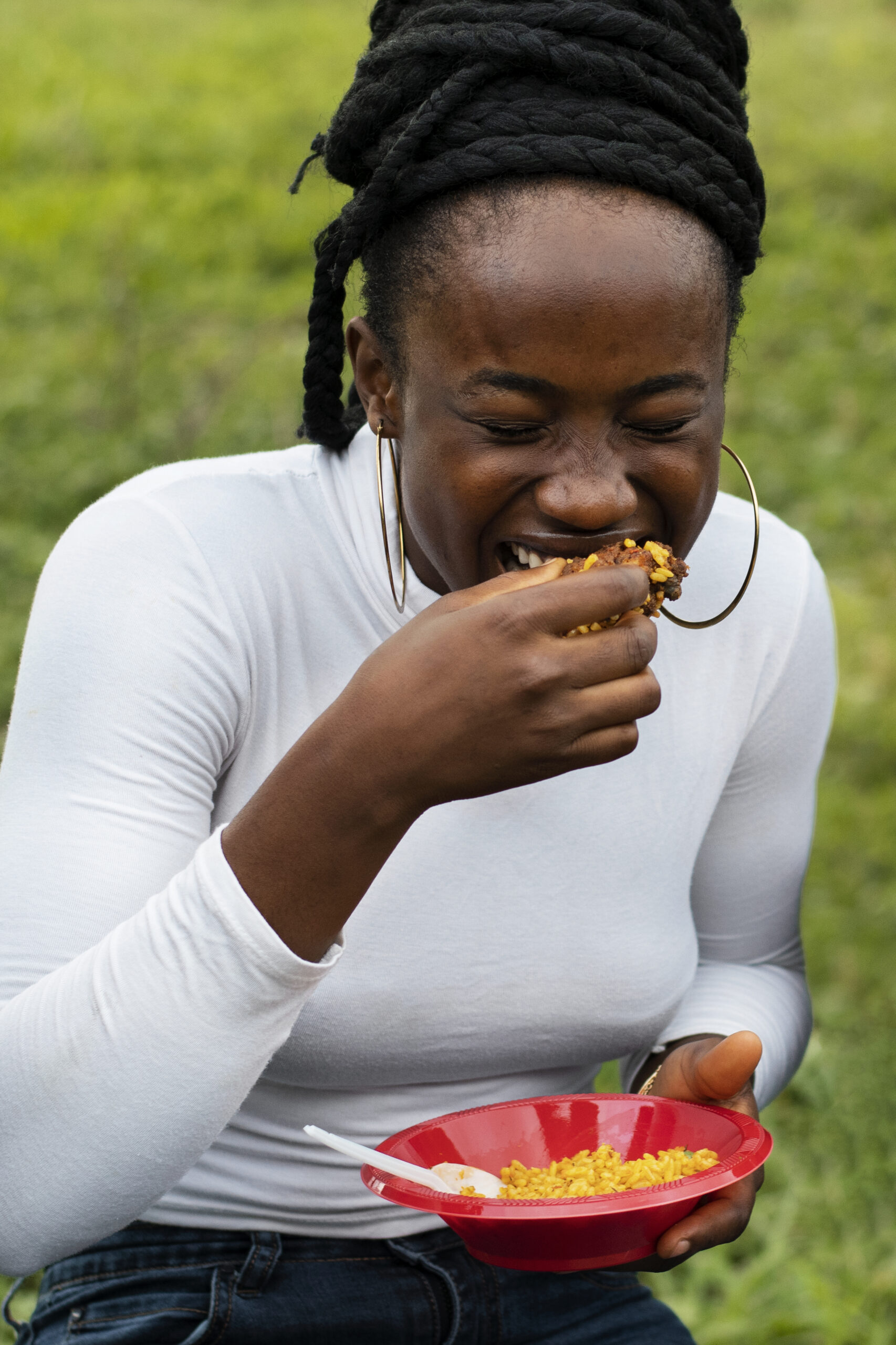 front view smiley woman eating lunch scaled