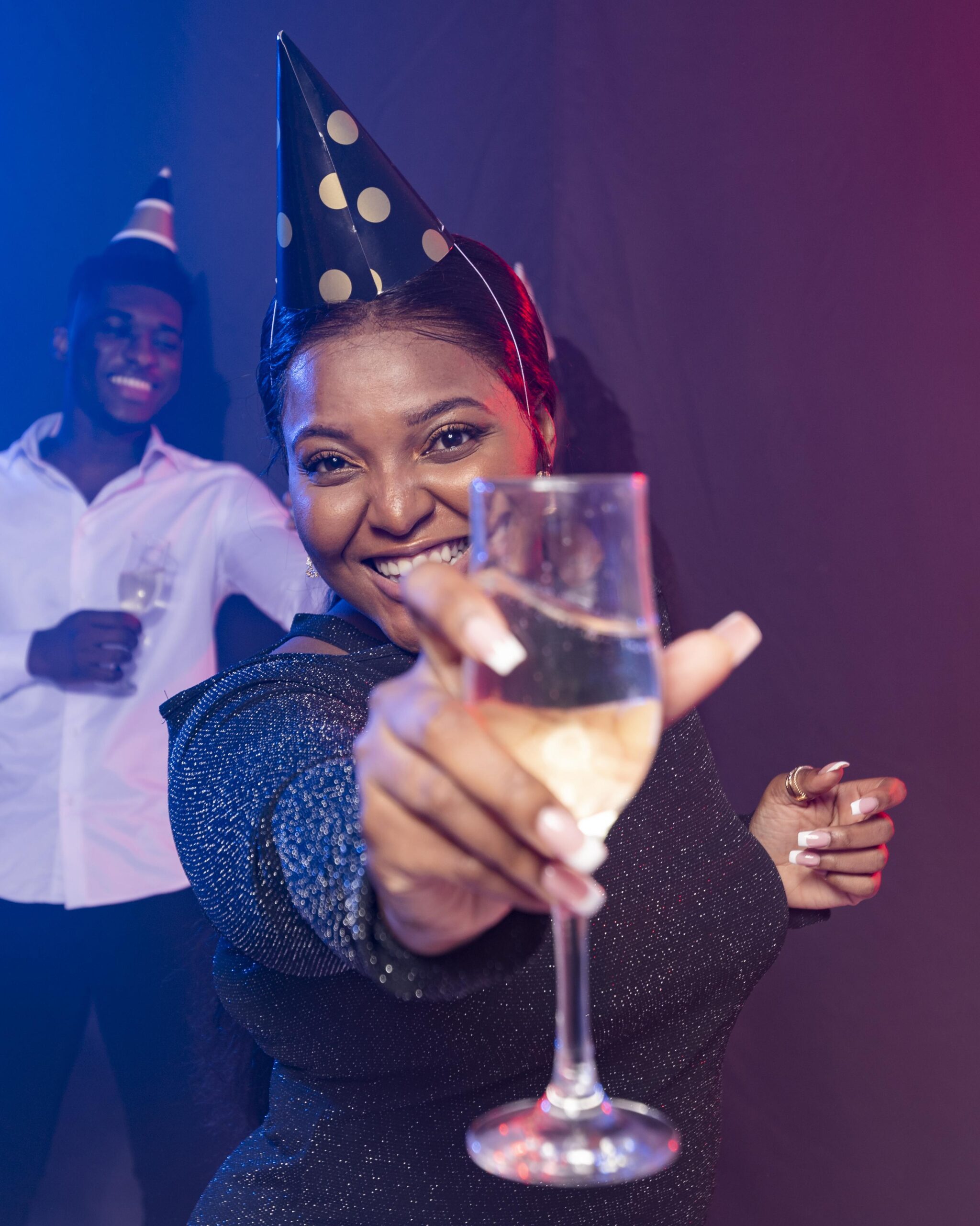 woman showing her champagne glass scaled